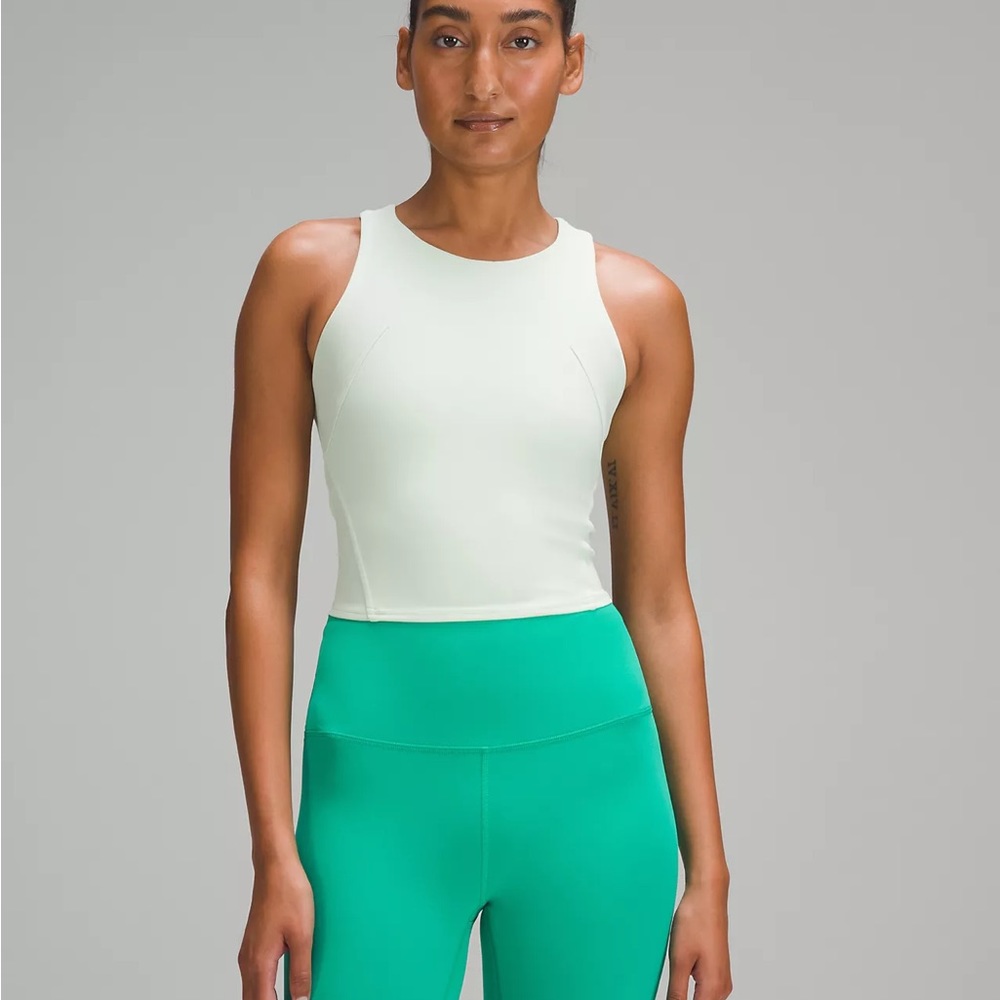 Lululemon Invigorate Train Tank Top NWT in color Kohlrabi Green. Size 0
